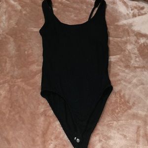 Black bodysuit more in the open back super cute
